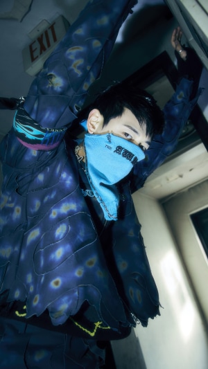 Minho from Shinee wearing a blue bandana and patterned jacket