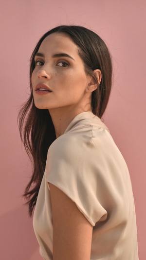Adria Arjona posing for a photoshoot