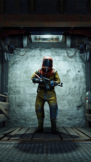 Rust character in hazmat suit holding assault rifle