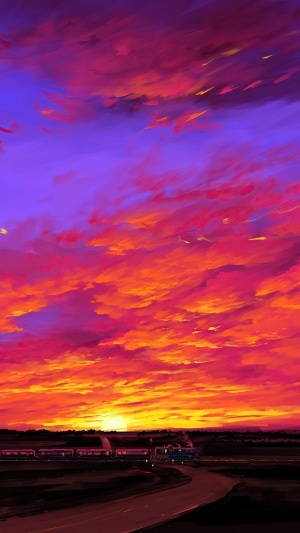 Train at sunset with vibrant clouds