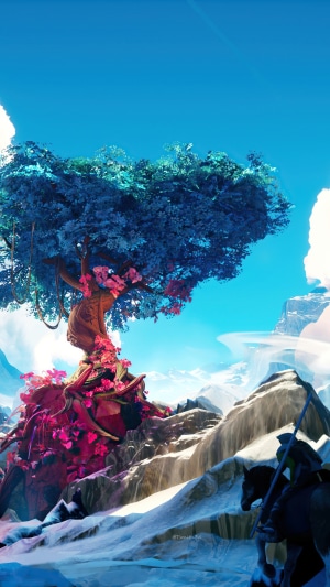 Fantasy tree with blue and pink leaves in snowy mountains