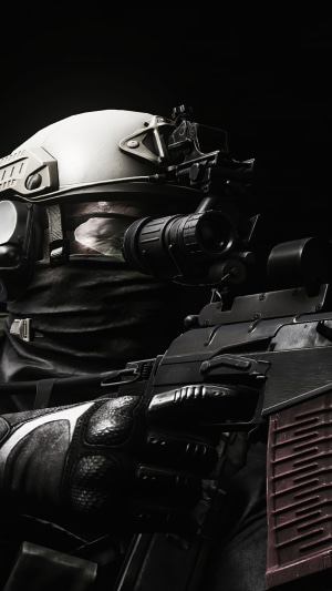 Soldier with rifle and night vision goggles