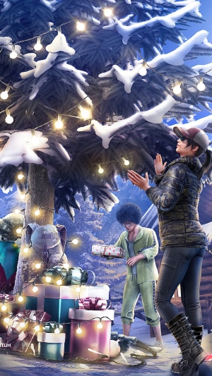Two characters by a Christmas tree with presents in PUBG