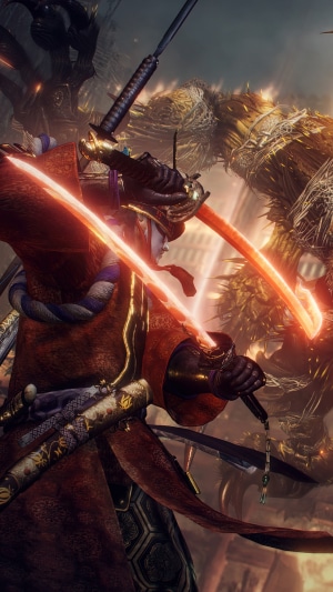 Nioh 2 character with glowing swords fighting a monster