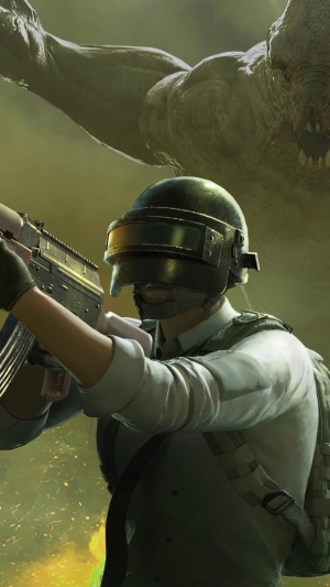 Player in PUBG Mobile aiming a rifle with a monster in the background