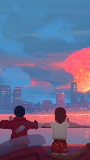 Couple watching a sunset over a city skyline