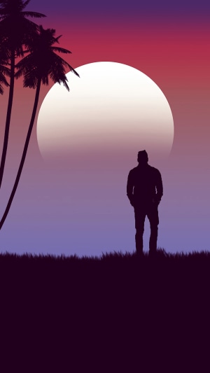 Silhouette of a man against a large moon and sunset