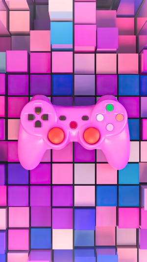 Pink video game controller on colorful cubes