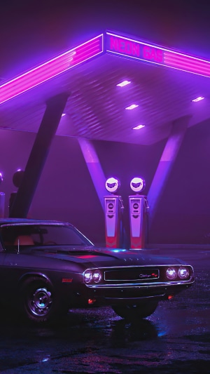 Retro car at a neon gas station at night