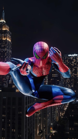 Spider-Man from Marvel's Spider-Man swinging through a city at night