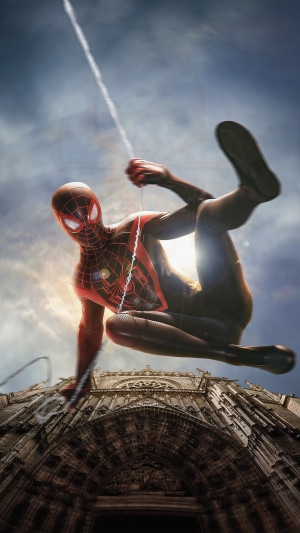 Spider-Man Miles Morales swinging over a cathedral