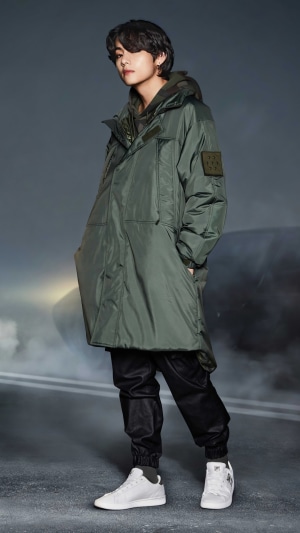 V from BTS in a green coat