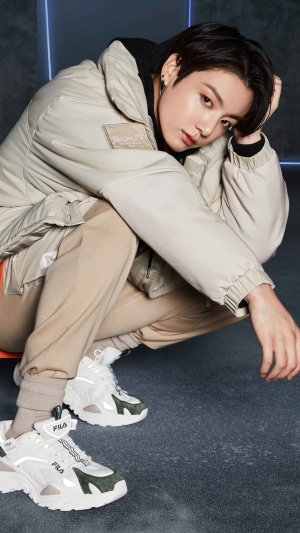 Jungkook from BTS posing in Fila outfit