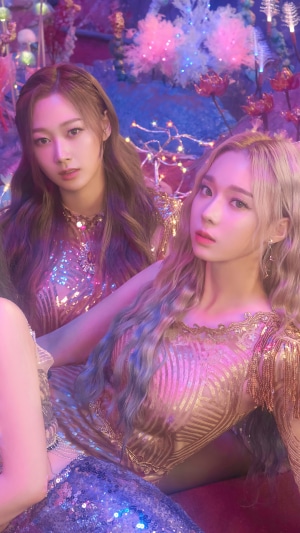 Aespa members Karina and Winter in sparkly outfits