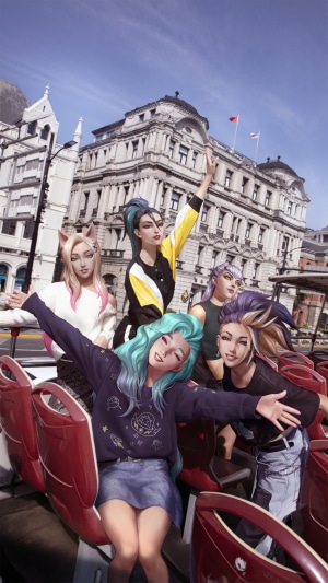 KDA members on a double-decker bus in a city