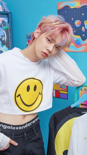 Yeonjun from TXT wearing a smiley face crop top