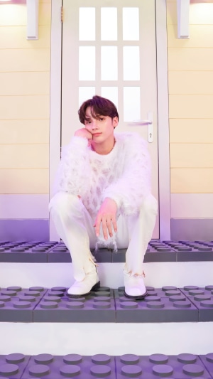 Huening Kai from TXT in white outfit