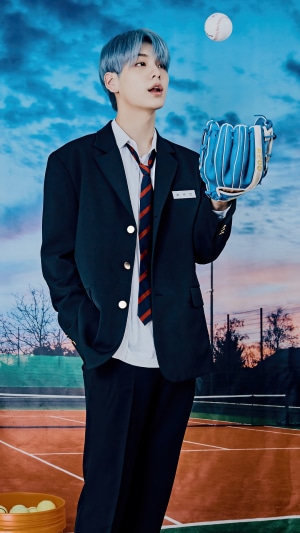 Soobin from TXT with baseball glove and ball
