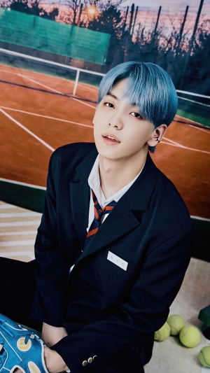 Soobin from TXT on a tennis court