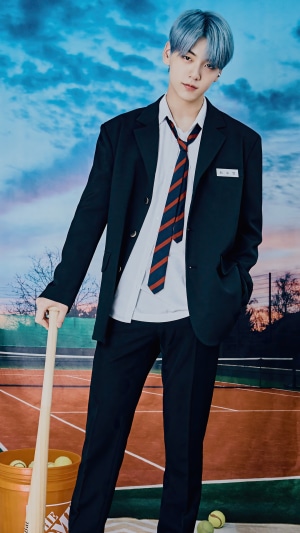 Soobin from TXT holding a baseball bat