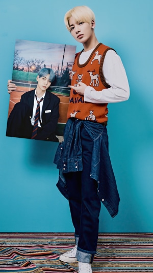 Taehyun from TXT holding a photo of Yeonjun