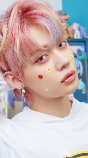 Yeonjun from TXT with smiley face stickers