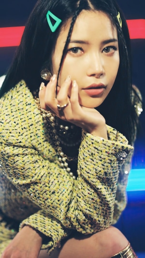 Solar from MAMAMOO posing in a yellow tweed jacket