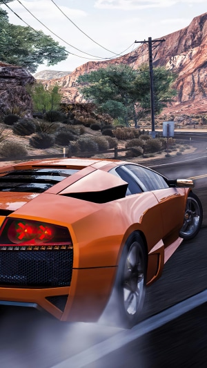 Orange car drifting on a road in Need for Speed Hot Pursuit