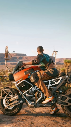 Motorcycle rider in Cyberpunk 2077 desert landscape