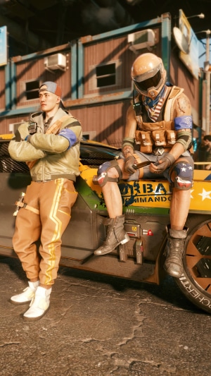 Two men sitting on a car in Cyberpunk 2077