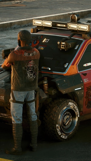 Man in leather vest next to a car in Cyberpunk 2077