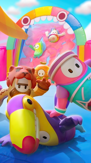 Fall Guys Ultimate Knockout characters on a colorful obstacle course