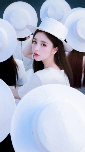 Heejin from Loona surrounded by white hats