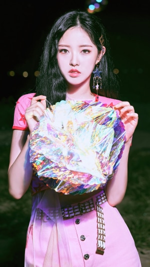 Olivia Hye from Loona holding a colorful object