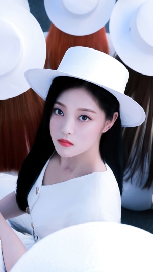 Hyunjin from Loona wearing a white hat
