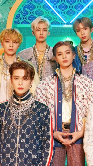 NCT U members in ornate outfits
