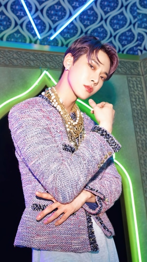 Doyoung from NCT U in a textured jacket and pearls