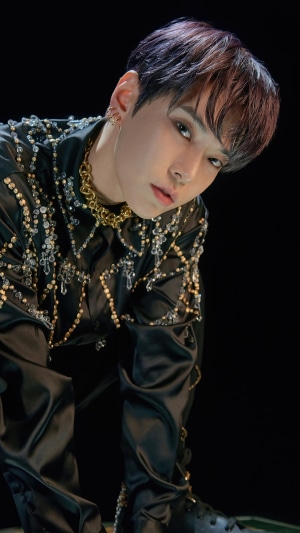Doyoung from NCT U in ornate black outfit