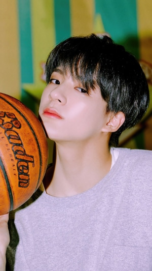 Jeno from NCT Dream with a basketball