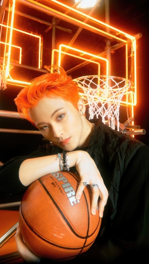 Mark from NCT U holding a basketball