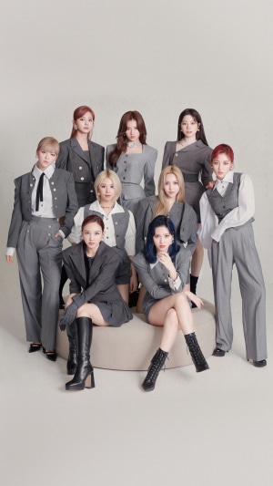 TWICE Kpop group posing in grey suits