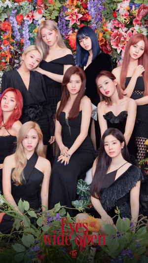 TWICE Kpop group posing with flowers