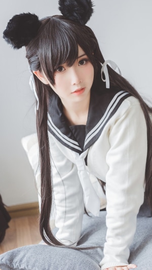Girl in Japanese school uniform with cat ears