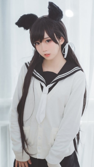 Japanese student in cosplay with black cat ears