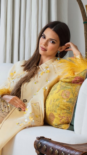 Kendall Jenner posing on a couch