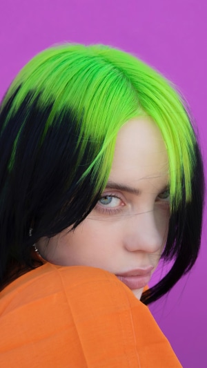 Billie Eilish with green and black hair