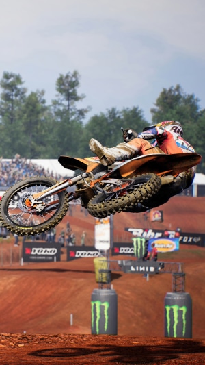 Motocross rider in mid-air during an MXGP race