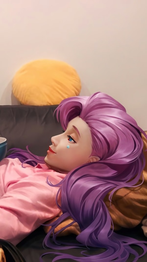 Seraphine from League of Legends lying on a couch