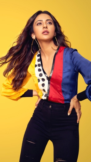 Rakul Preet Singh in a colorful shirt and ripped jeans