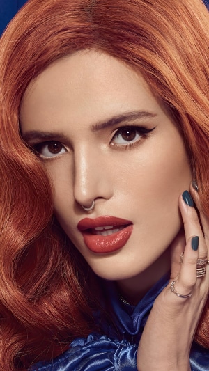 Bella Thorne with red hair and makeup